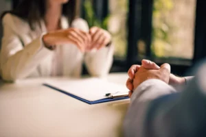 An attorney speaking to a client.